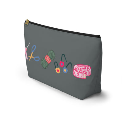 Gray pouch with colorful sewing tools illustration on a white background
