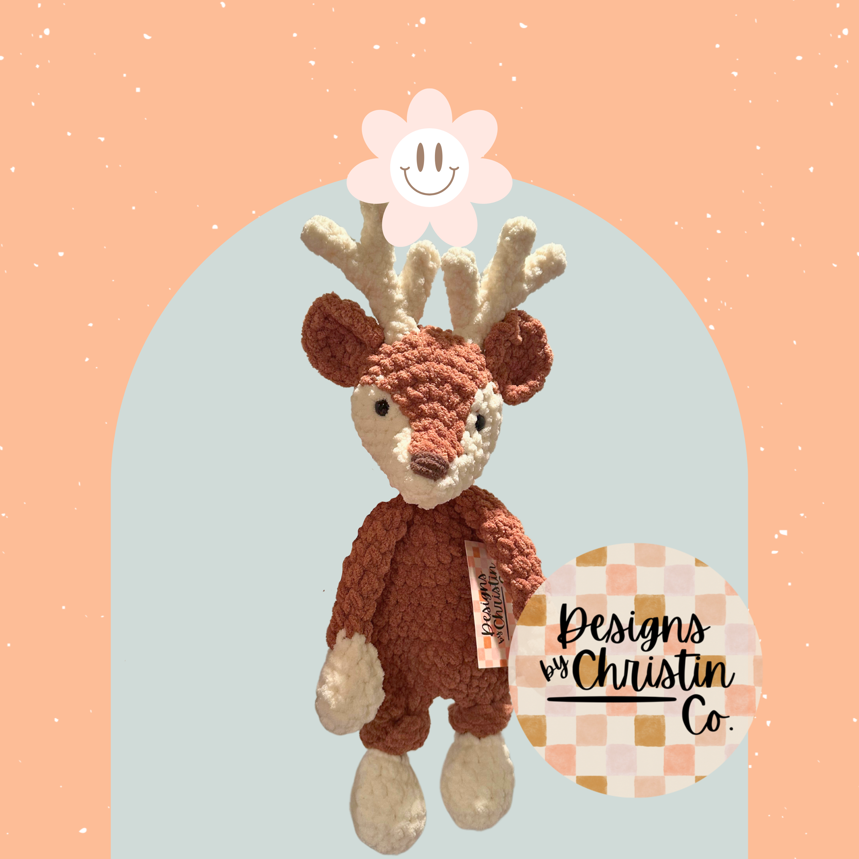 A crochet plush toy deer lovey with a stuffed head and an unstuffed body, primarily brown and off-white  in color.
