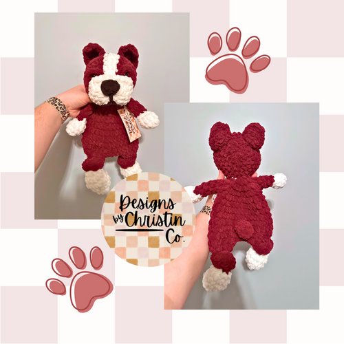 a maroon and white bulldog crochet plush lovey with a stuffed head and paws and an unstuffed body.