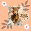 A crochet brown teddy bear-shaped lovey with a stuffed head and an unstuffed body.